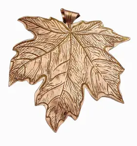 A copper maple leaf pendant